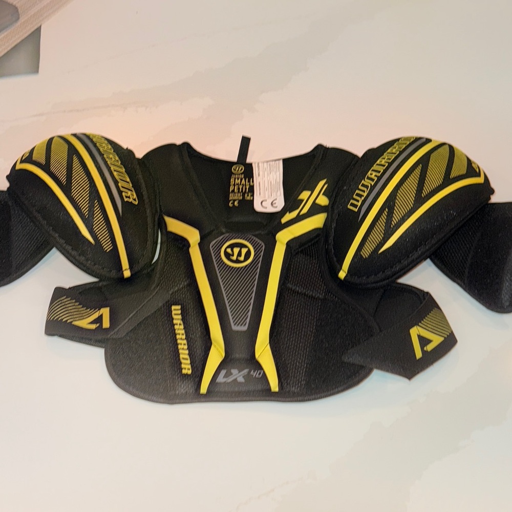 Boys size junior small 
Warrior Black and Yellow Shoulder Pads